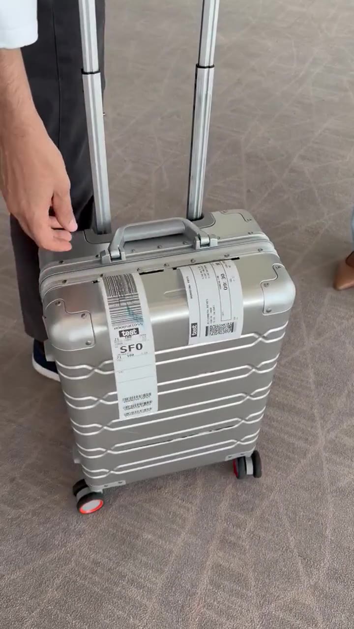 CounterGO aluminium carry-on with a freshly printed bag tag and boarding pass