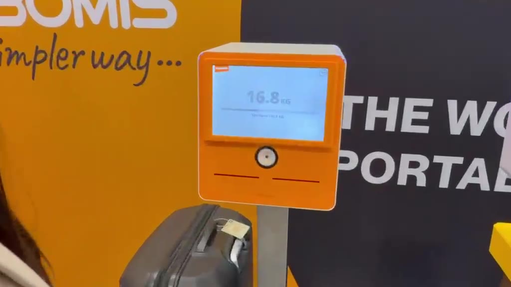 A passenger's bag on the TAGROP scale, weight shown on screen